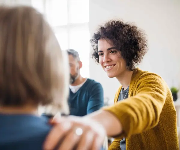 Group Therapist Reaching Out