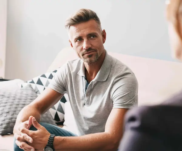 Man in Conversation with Therapist